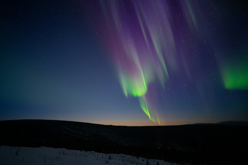 A Majestic Display: Northern Lights and Meteor Showers Dazzle Night Skies